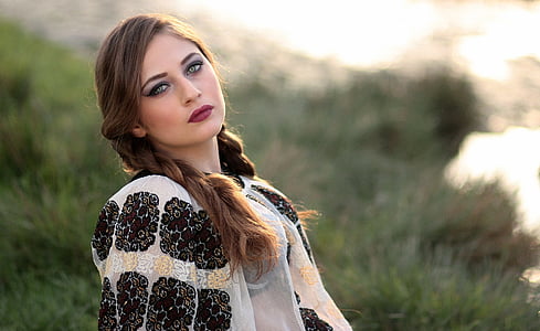 woman wearing black and white floral dress thumbnail