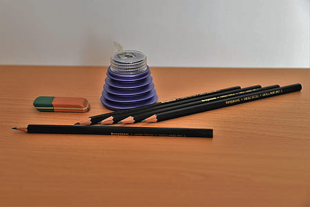 pencils on wooden table thumbnail