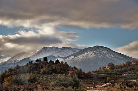 brown and white mountains at daytime thumbnail