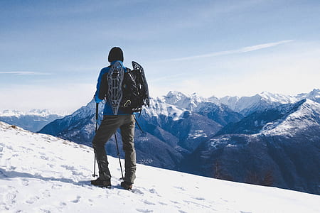 man hiking on snow covered mountain thumbnail