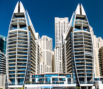 white concrete buildings with glass panel thumbnail