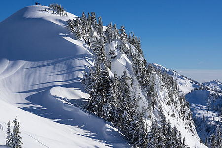 snow covered hill taken at daytime thumbnail