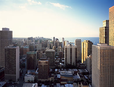 cityscape under white clouds and blue sky at daytime thumbnail