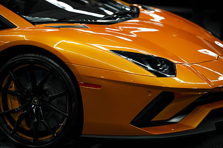 orange vehicle in closeup photography thumbnail