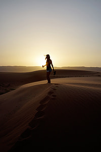 woman stands on desert island thumbnail
