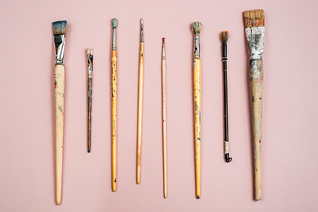 Paint brushes on pink background thumbnail