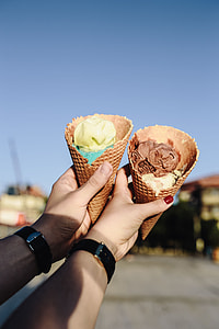 Man and Woman Holding Ice Creams thumbnail