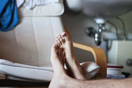person's feet on chair thumbnail