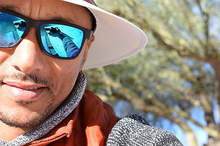 man wearing white cap and sunglasses thumbnail