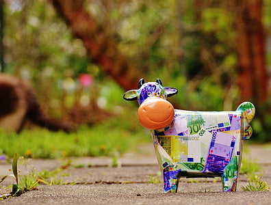 selective focus photograph of cow figurine thumbnail