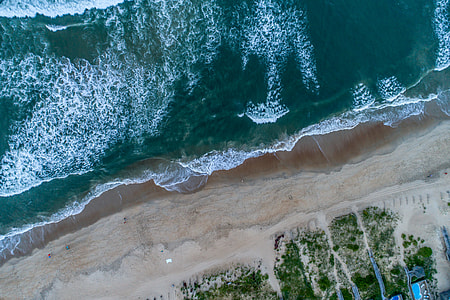 aerial shot of beach during day time thumbnail
