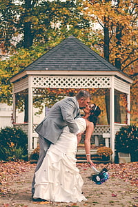 couple near gray wooden gazebo thumbnail