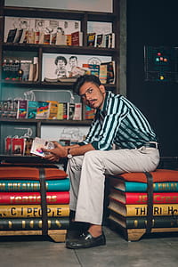 Photo of Man Holding a Book thumbnail