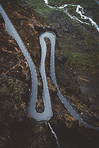 aerial photography of curved road thumbnail
