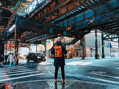 man wearing red backpack thumbnail
