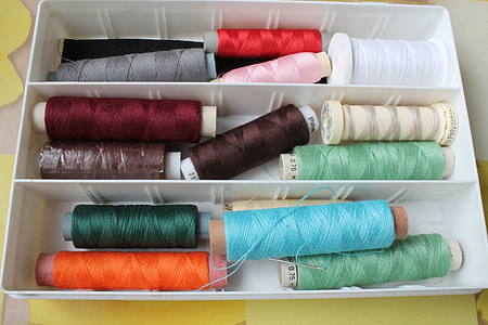 assorted-color thread spool lot in box thumbnail