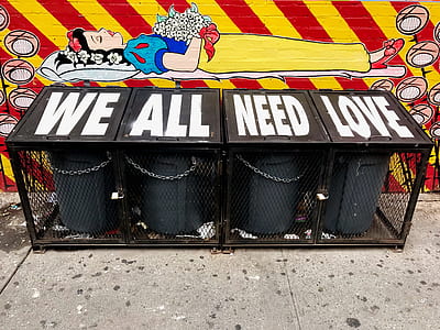 four black metal trash bins thumbnail
