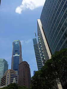low angle photo of white and gray high-rise building thumbnail