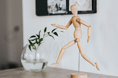 Wooden mannequin in various poses thumbnail