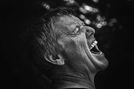focus photography of growling man thumbnail