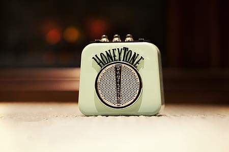 Selective Focus Photography of Honey Tone Mini Amp thumbnail