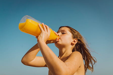 toddler' drinking juice on plastic bottle thumbnail