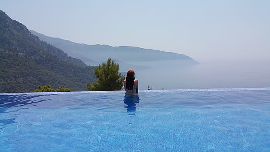 woman near green trees during daytime thumbnail