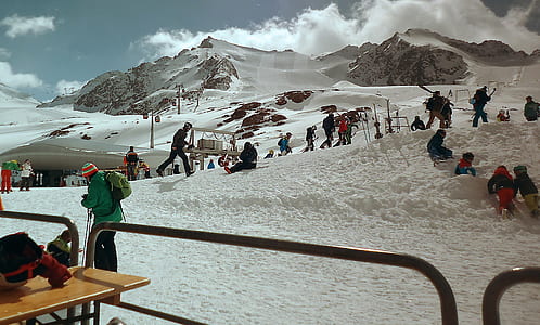group of people on snow at daytime thumbnail