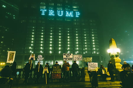 people holding placards during nighttime thumbnail