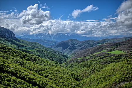 green mountain during daytime thumbnail