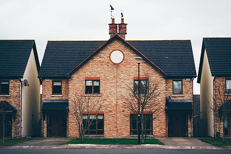brown and black concrete house thumbnail