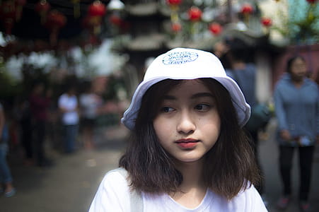 Woman Wearing White Bucket Cap thumbnail