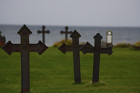 cross on grass during daytime thumbnail