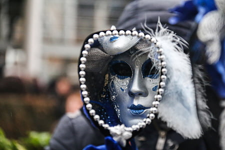 person wearing silver and blue mask thumbnail