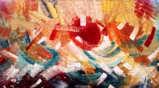 multicolored abstract painting on brick wall thumbnail