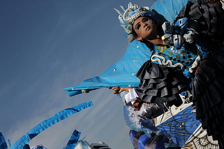 woman wearing blue and black costume thumbnail