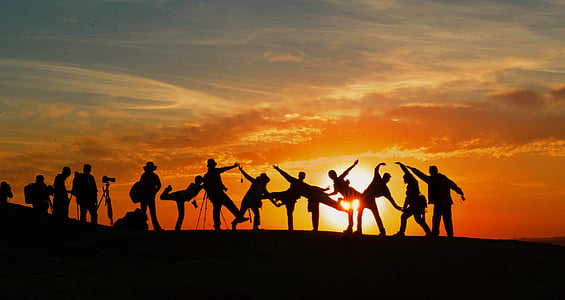 silhouette photograph of group of people during golden hour thumbnail