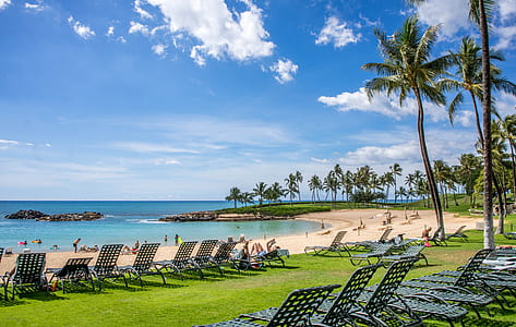 blue chairs near body of water during day time thumbnail