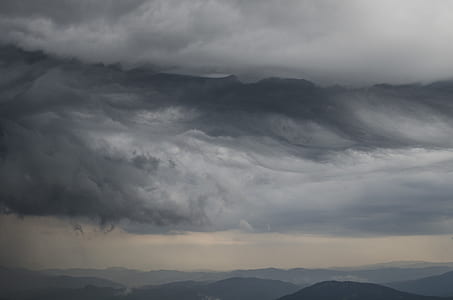 mountain rage view under cloudy sky during daytime thumbnail