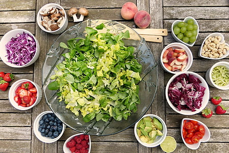 sliced vegetables and fruits on bowls thumbnail
