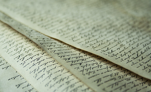 closeup photo of beige printed paper thumbnail