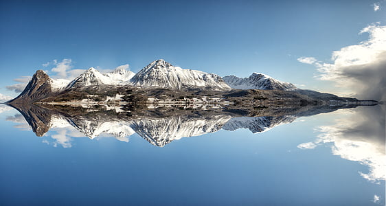 snow mountain beside white sky under blue sky thumbnail