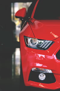 red vehicle parked inside building thumbnail