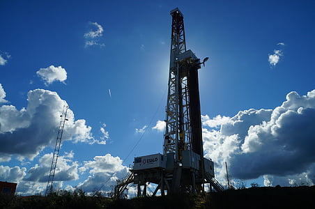 gray electric tower under white clouds thumbnail
