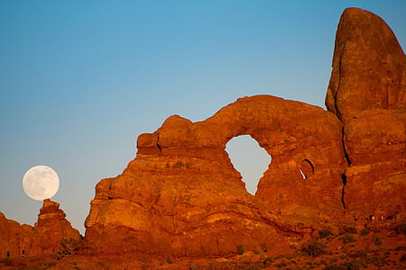 brown rocks under full moon thumbnail