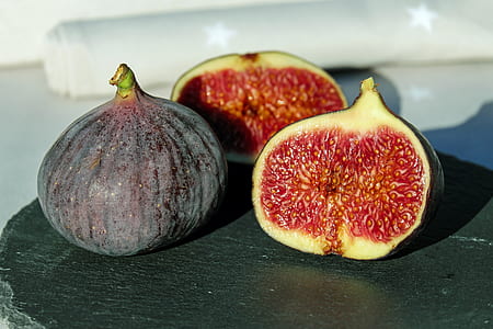 three fig fruits on brown surface thumbnail