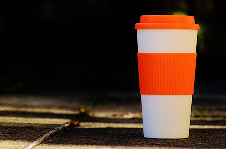 white and red tumbler on black surface thumbnail