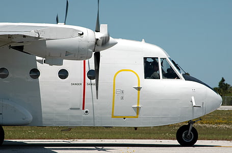 white airplane on pavement thumbnail