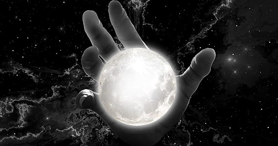 human hand holding moon thumbnail
