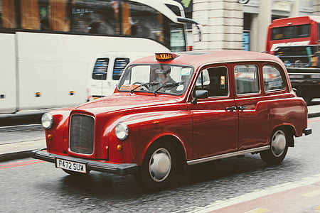 vintage red car on street during daytime thumbnail